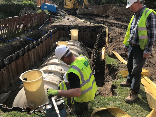 First tank lowered into position onto concrete base